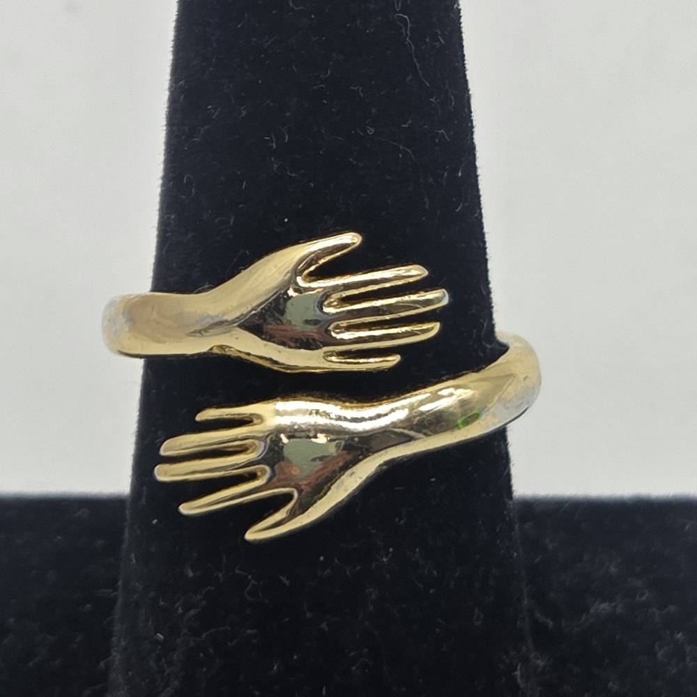 finger hugging hands ring gold tone costume some wear adjustable sz 7.5